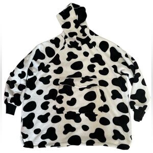 Cow print fleece/sherpa wearable blanket, one size fits most.